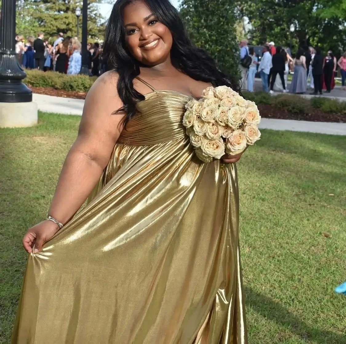 Model wearing a gold gown