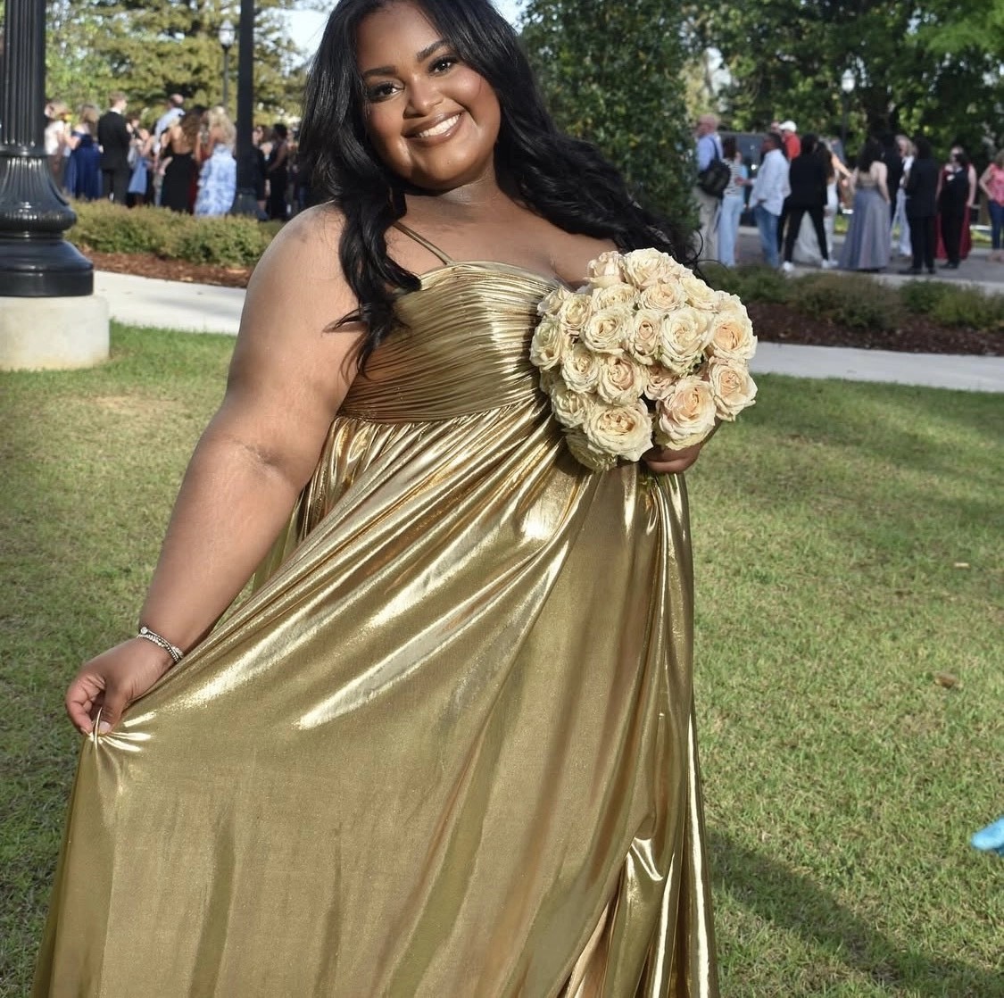 Model wearing a gold gown